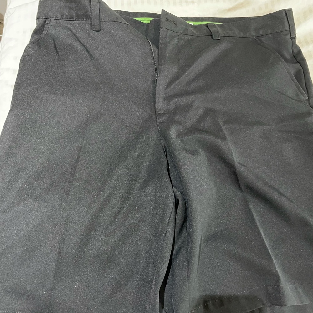 Izod black golf shorts. Size 38